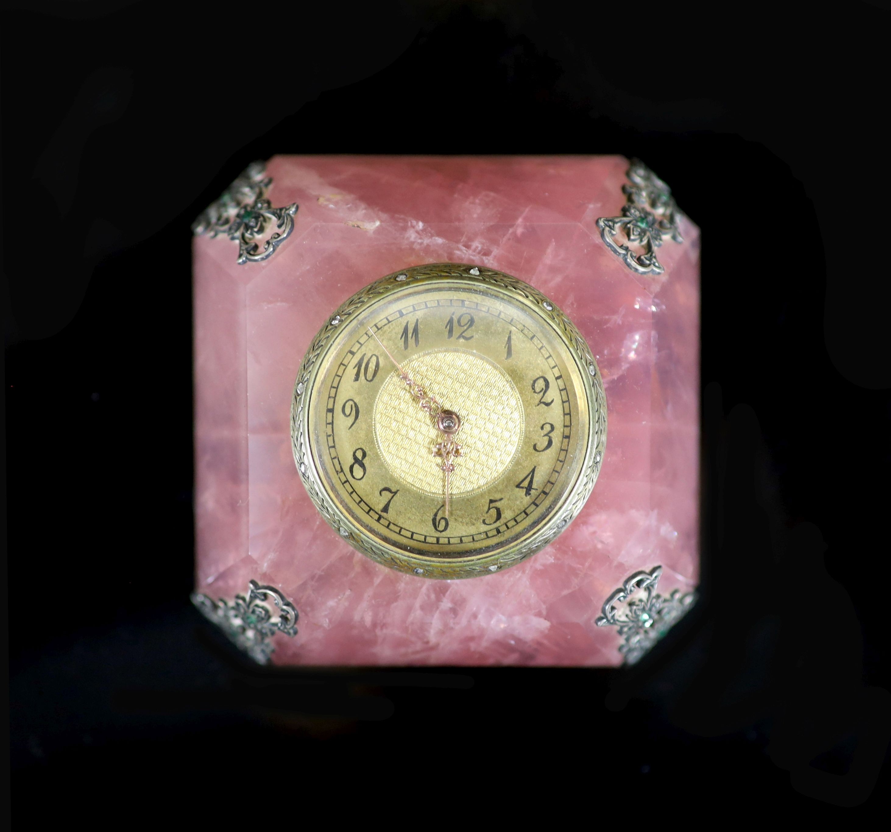 An early 20th century emerald, rose cut diamond, silver and gilt metal mounted rose quartz timepiece